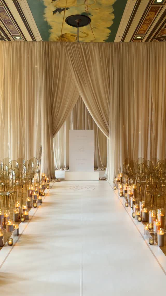 A candlelit white ceremony aisle at the Fairmont Royal York