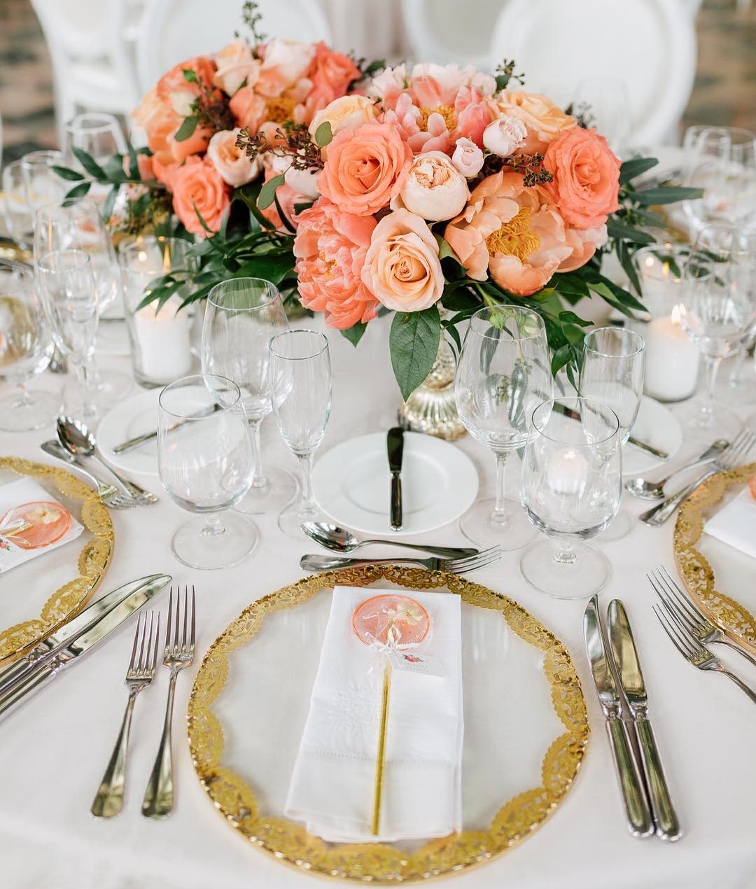Coral peonies, roses, crystal glassware, and gold-rimmed plates at Amanda’s bridal shower