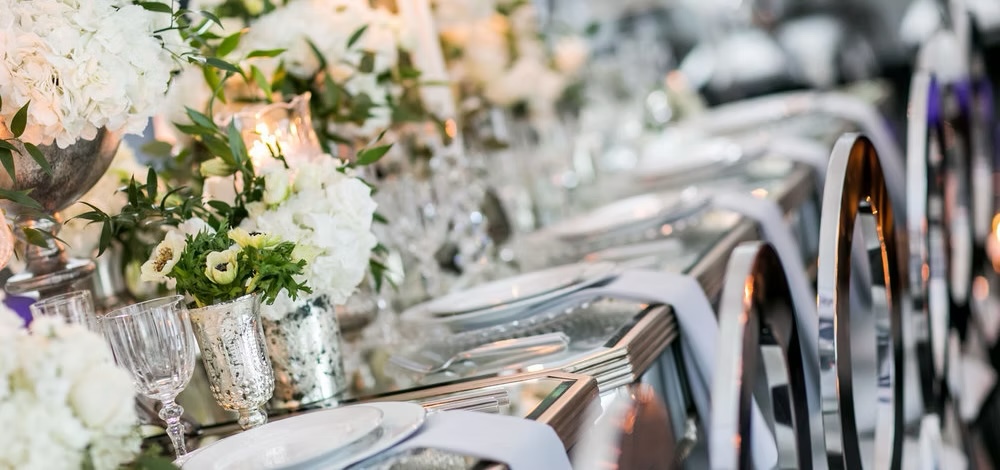 A silver and crystal social event table