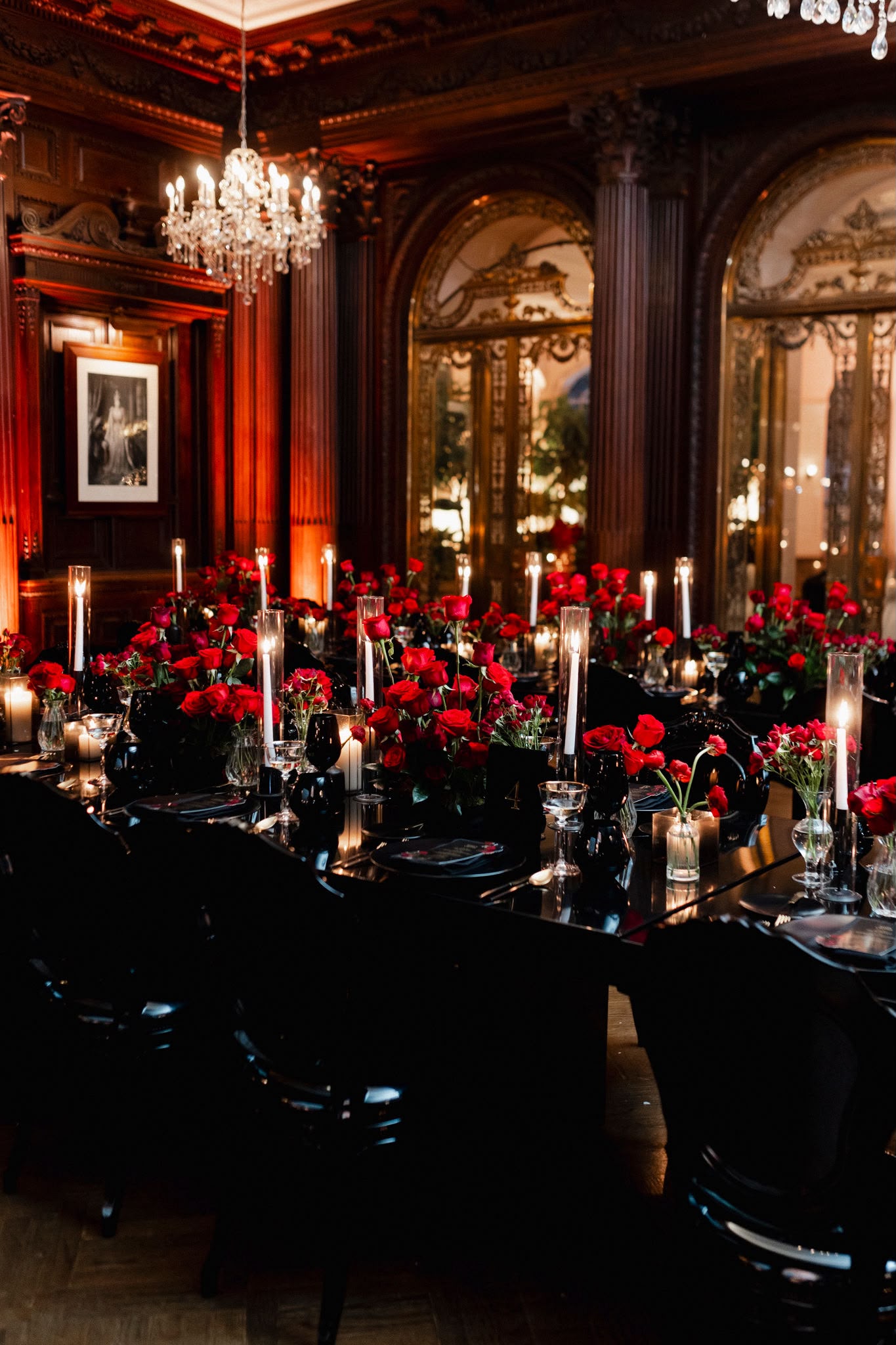 Casa Loma's wood-panelled library glowing with red roses and candlelight